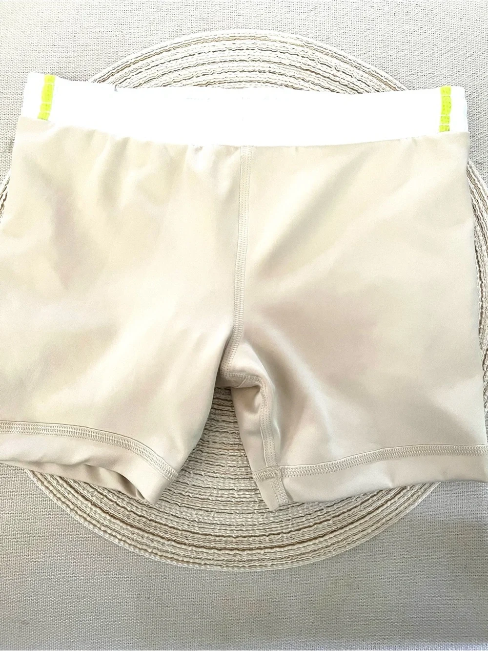 Nike Beige Sports Shorts with White Mesh Overlay and Neon Green Trim